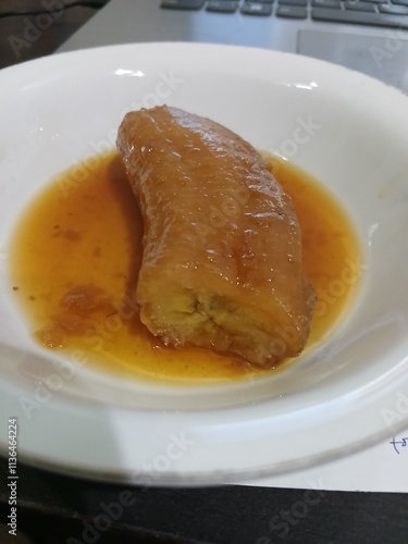 Dessert boiled banans in sweet sauce  photo