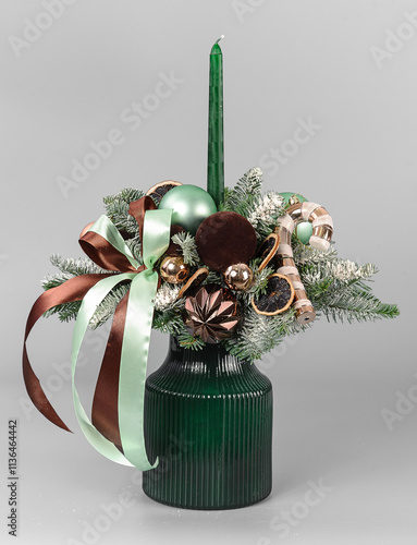 A traditional Christmas floral arrangement of green fir branches and flowers. New Year's decor for the interior