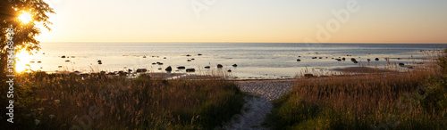 Panoramic seascape with scenic beach scene and rocks, Horneks Odde, Laeso, Denmark photo