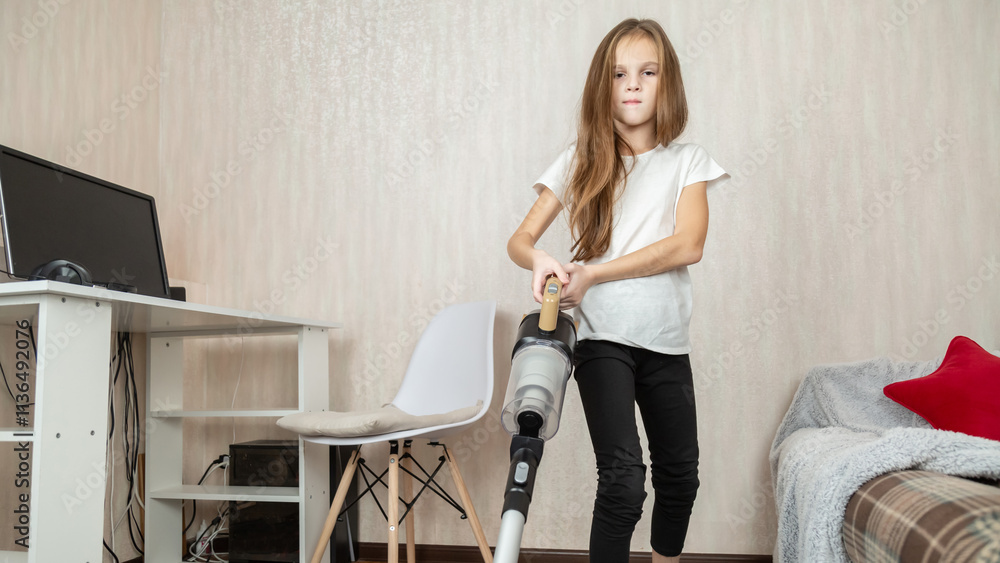 Little girl using vacuum cleaner in room