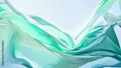 Flowing green fabrics creating elegant waves in motion