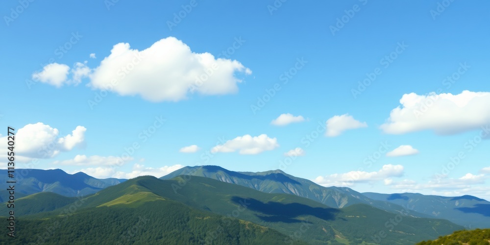 Fototapeta premium Serene landscape of rolling green hills under a vibrant blue sky dotted with fluffy white clouds