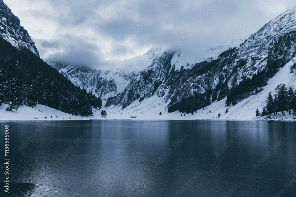 Black ice on the Seealpsee Alpstein in frozen winter landscape, Switzerland Black ice on the Seealpsee Alpstein in frozen winter landscape, Switzerland