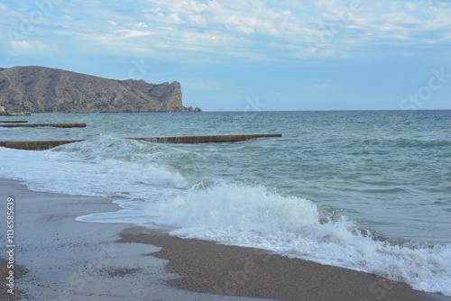 Background landscape view of Sudak Bay, the city of Sudak and its embankment in Crimea