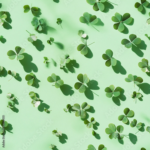 Clover Leaves Scattered Across a Green Background Creating a Natural Pattern