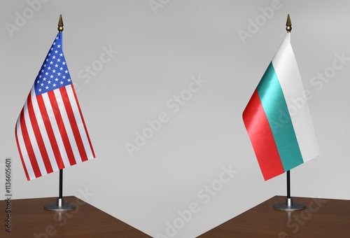 Table flags of USA and Bulgaria on a gray blurred background