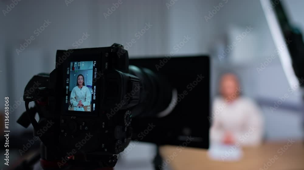 Modern camera shooting a woman giving a speech. Close up. Blogger recording a video. Modern camera shooting a woman giving a speech. Close up. Blogger recording a video.
