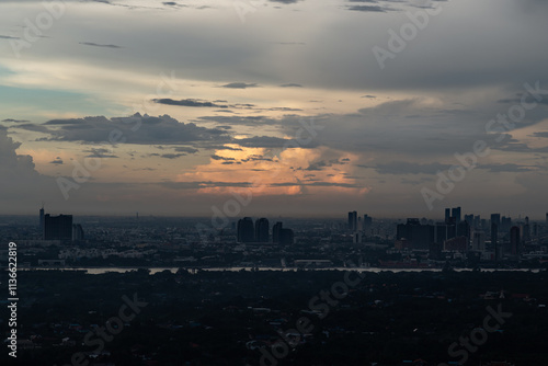 view of Bangkok city and beautiful clouds in sky background with the Chao Phraya River before sunset. use it as your wallpaper, poster and Space for text, Selective focus.