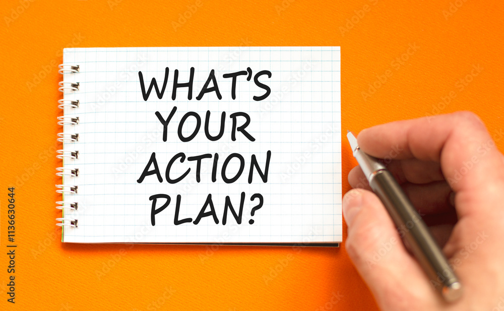 Action plan symbol. Concept words What is your action plan on beautiful white note. Beautiful orange table orange background. Businessman hand. Business What is your action plan concept. Copy space Action plan symbol. Concept words What is your action plan on beautiful white note. Beautiful orange table orange background. Businessman hand. Business What is your action plan concept. Copy space