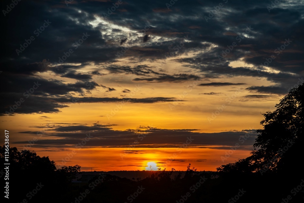 Fototapeta premium Dramatic sunrise with intense natural orange lights and idyllic dramatic scenery