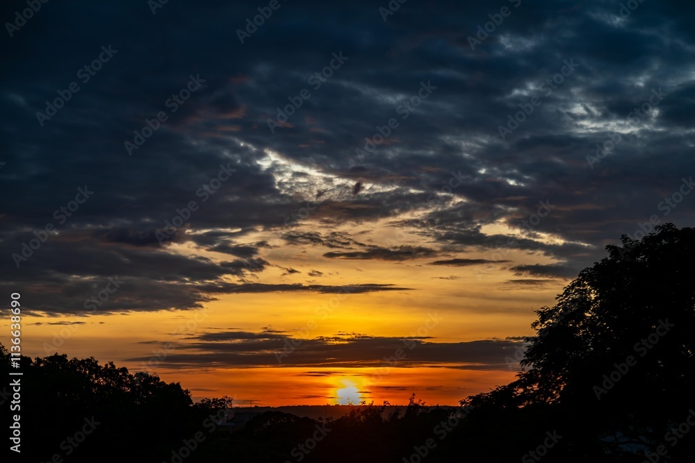 Dramatic sunrise with intense natural orange lights and idyllic dramatic scenery Dramatic sunrise with intense natural orange lights and idyllic dramatic scenery