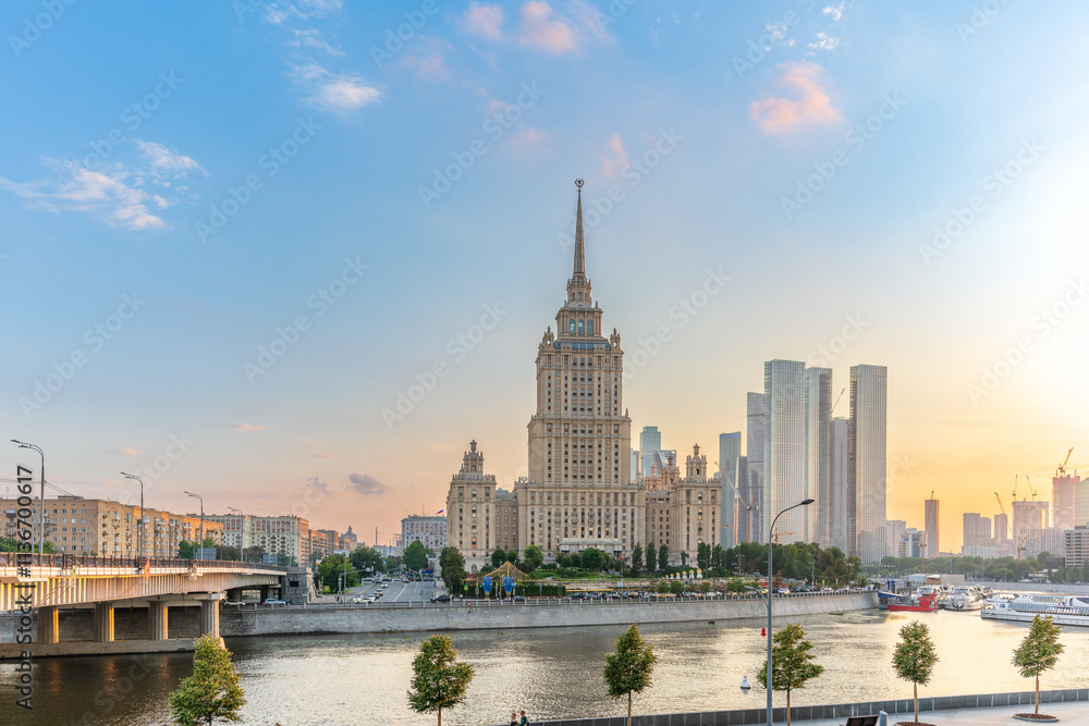 Obraz premium High-rise stalinist building near river at summer sunset in Moscow, Russia. Historic name is Hotel Ukraine.