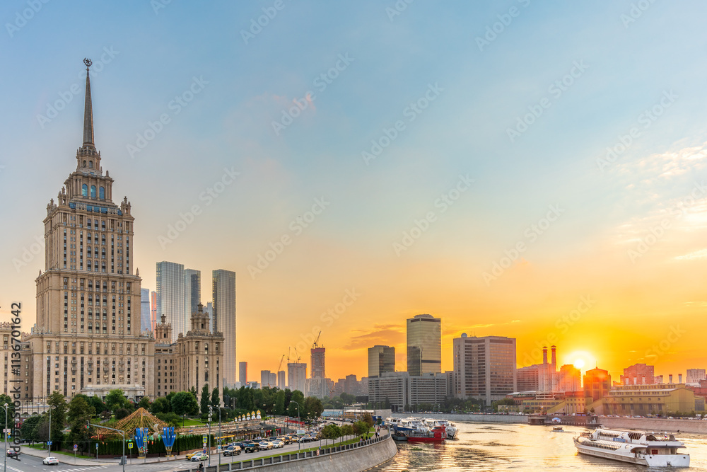 Obraz premium High-rise stalinist building near river at summer sunset in Moscow, Russia. Historic name is Hotel Ukraine.