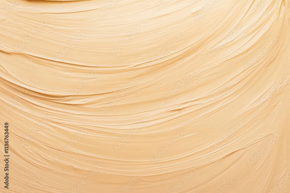 Chunky peanut butter texture spread across a surface revealing creases and waves from a culinary application Chunky peanut butter texture spread across a surface revealing creases and waves from a culinary application