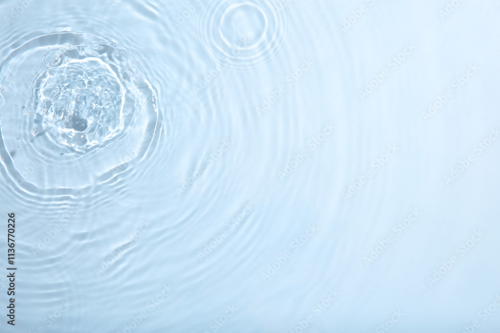 Rippled surface of clear water on light grey background, top view Rippled surface of clear water on light grey background, top view