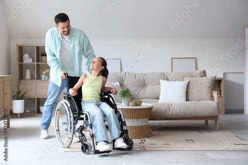 Little girl in wheelchair w...
