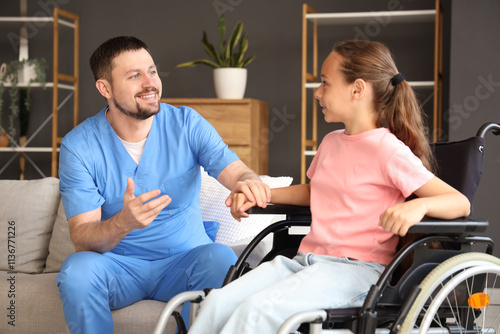 Little girl in wheelchair w...