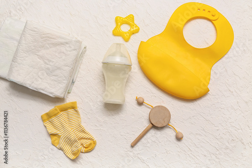 Composition with bottle of milk for baby and accessories on light background photo