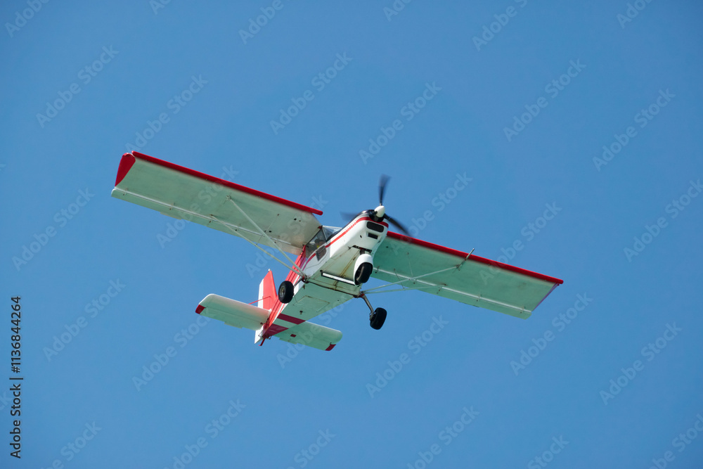 A light-engine tourist airplane in the blue sky. Copy space A light-engine tourist airplane in the blue sky. Copy space