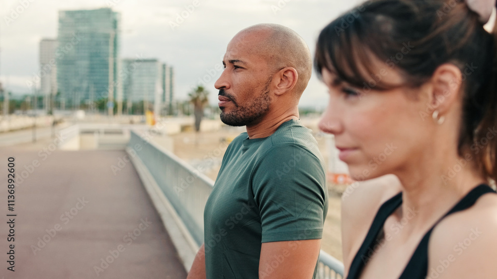 Male and female athletes in summer exercises their shoulders for muscle strength and talking, enjoy teamwork, couple goals and motivation. Happy fit people are cheerfully doing sports Male and female athletes in summer exercises their shoulders for muscle strength and talking, enjoy teamwork, couple goals and motivation. Happy fit people are cheerfully doing sports
