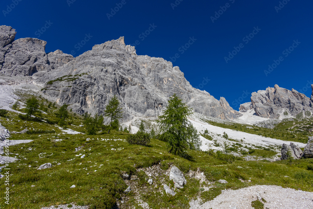 Dolomites sunny weather in summer mountains. Green valley and beautiful mountain rocky peaks in the Alps. Alpine scenic landscape in South Tyrol region in Italy Dolomites sunny weather in summer mountains. Green valley and beautiful mountain rocky peaks in the Alps. Alpine scenic landscape in South Tyrol region in Italy