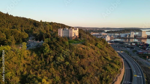 Drone over Ekebergåsen and Ekeberg in Oslo with a new tram going up the hill