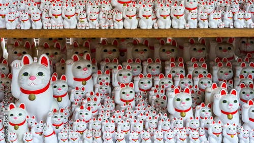 Gotokuji Temple: Tokyo's Birthplace of Maneki Neko 'Lucky Cat' Shinto Shrine for good fortune and Cat Lovers. Porcelain figure and temple details