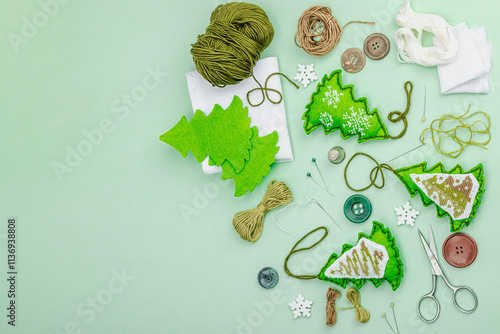 Traditional New Year composition.Festive handmade decor, Christmas trees embroidered with a cross photo