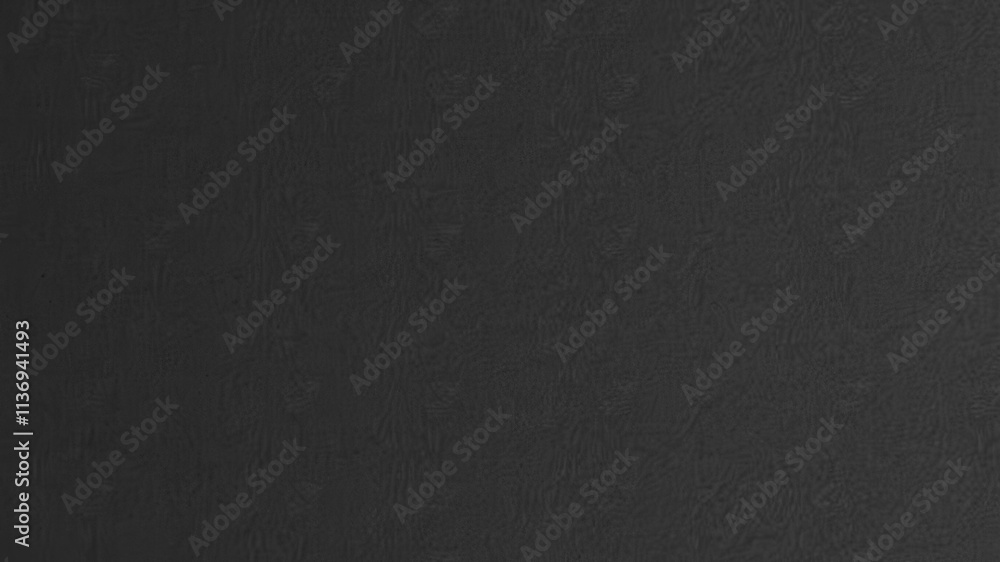 Fototapeta premium Black paper with a smooth, matte texture ideal for backgrounds or overlays on designs, abstract, simple