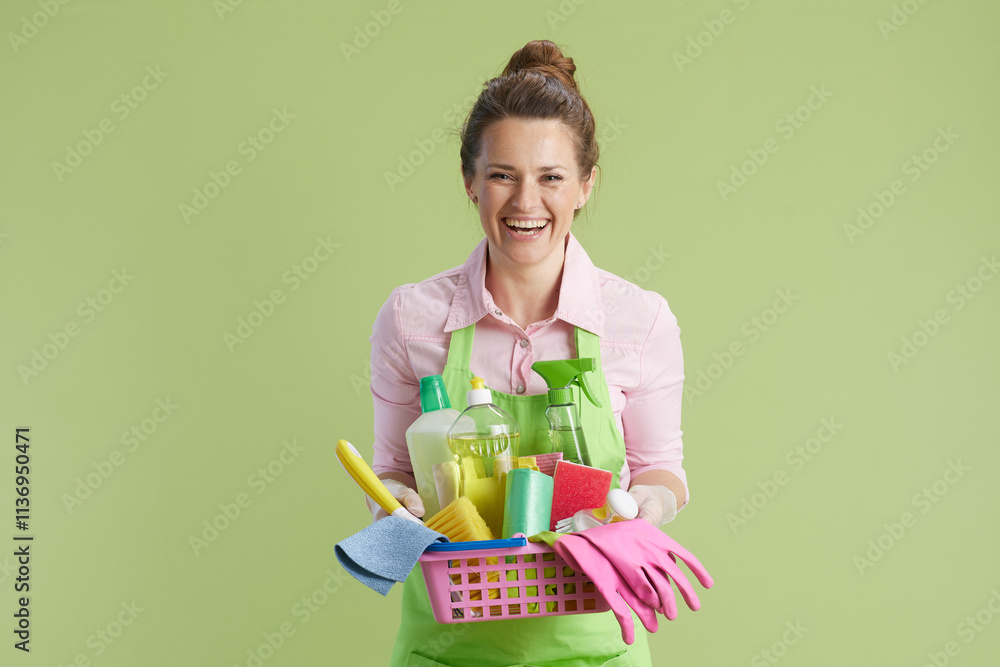 happy woman in green apron and rubber gloves on green happy woman in green apron and rubber gloves on green
