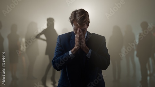 The consequences of promiscuous sexual relations, concept. A young man is stressed and there are many ex-partners in the background. Sexually transmitted diseases