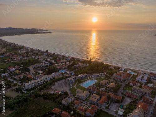 Aerial view of a coastal town at sunset. photo