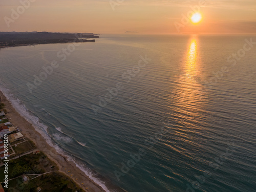 Aerial view of a coastal town at sunset. photo