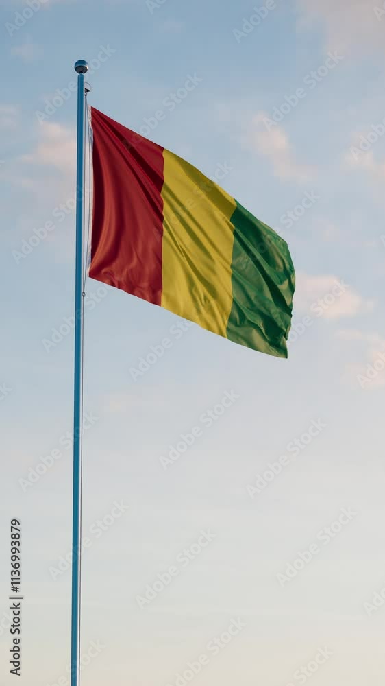 Guinea Conakry Flag Vertical Cinematic Realistic Waving Dolly Out Blue Sky Guinea Conakry Flag Vertical Cinematic Realistic Waving Dolly Out Blue Sky