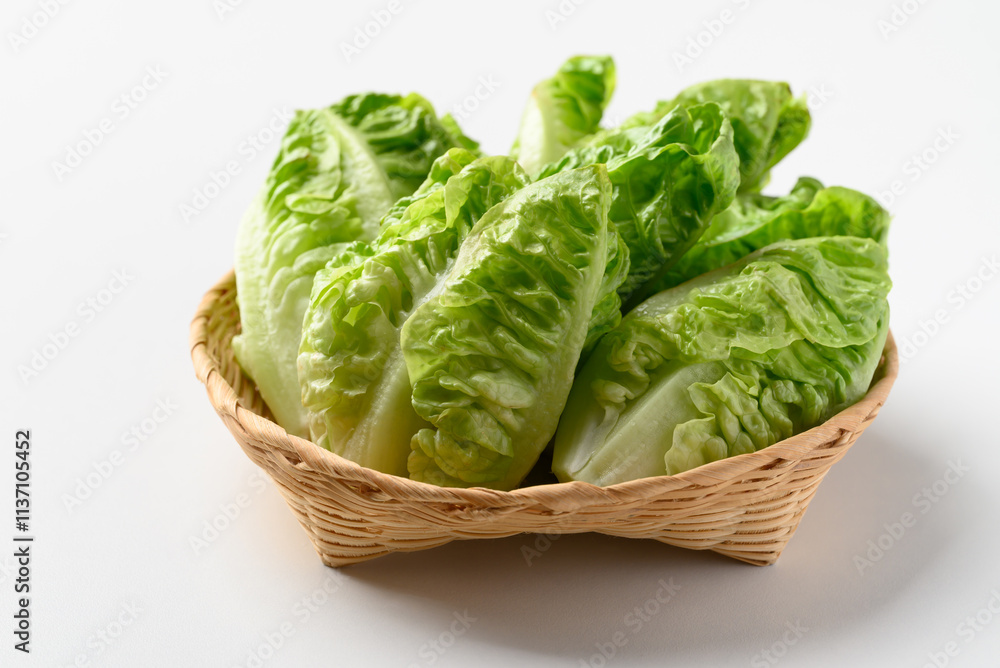 Baby cos lettuce romaine in basket on white background, Fresh vegetable Baby cos lettuce romaine in basket on white background, Fresh vegetable