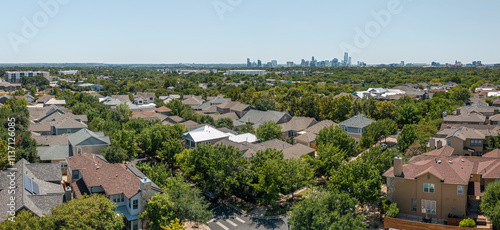 Stunning aerial view of Mueller community in Austin, Texas showcasing vibrant greenery and downtown skyline