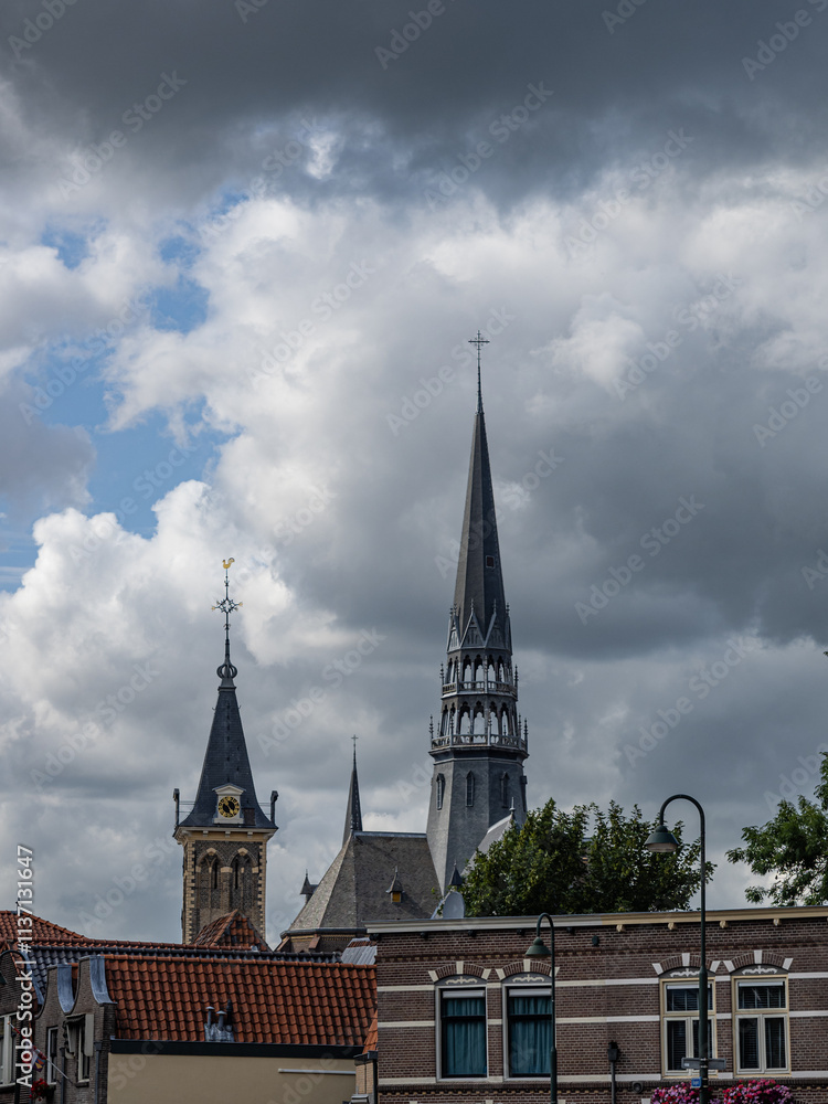 Photograph of a street in Gouda with the Barbara Tower in the background. Netherlands Photograph of a street in Gouda with the Barbara Tower in the background. Netherlands