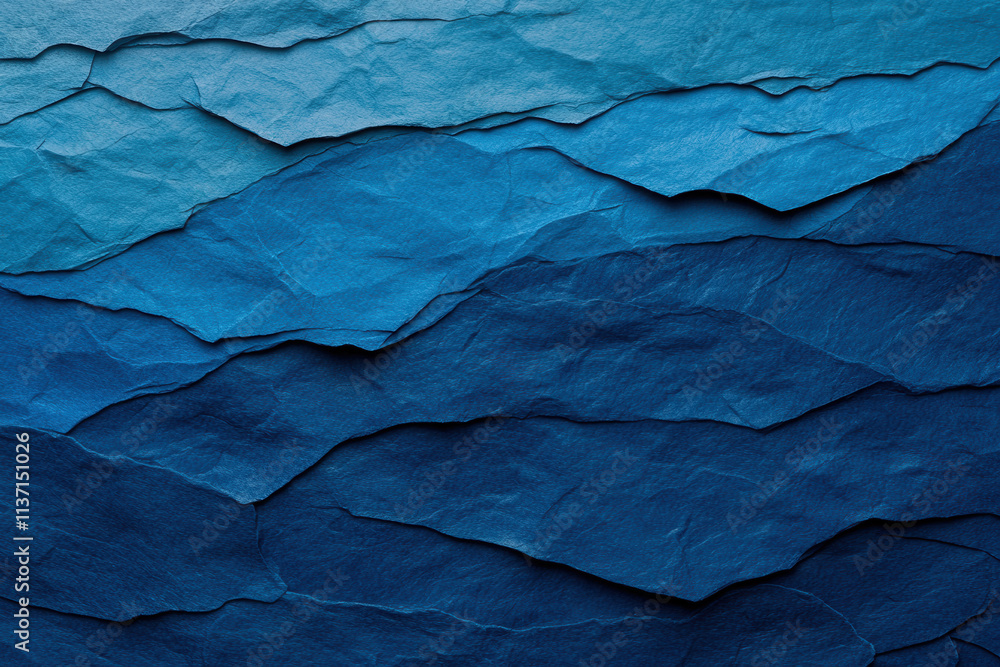 Fototapeta premium Textured layers of deep blue and turquoise paper create serene oceanic feel. varying shades evoke calmness and depth
