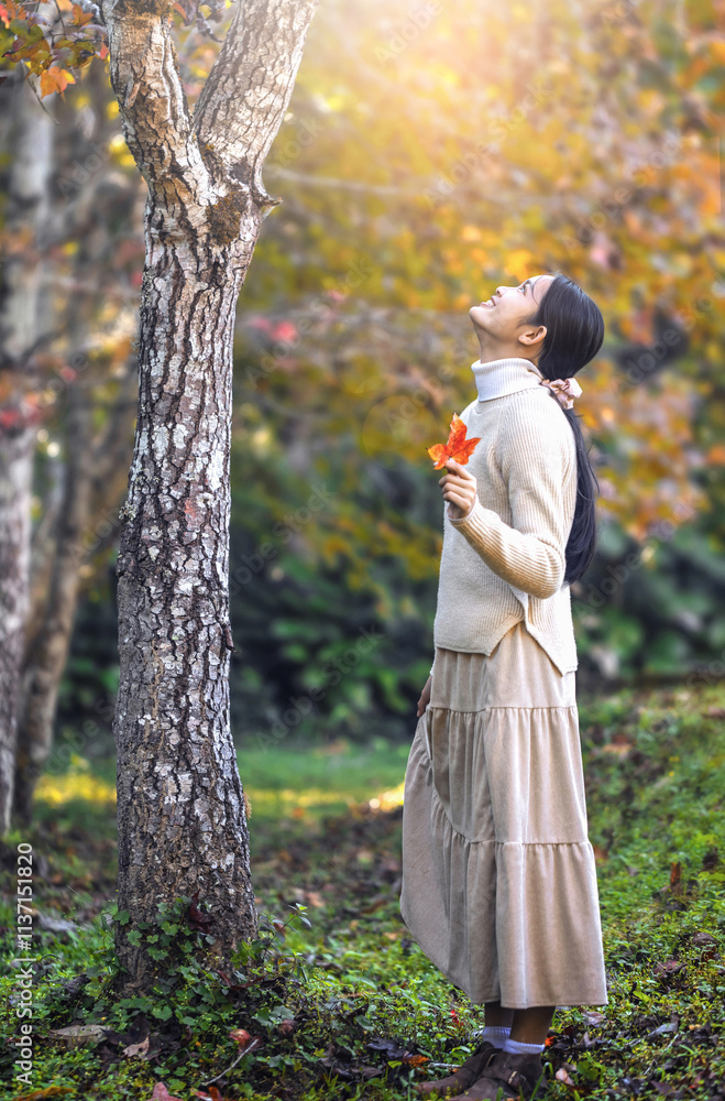 Girl young lady enjoying in the autumn park with fallen fall leaves Girl young lady enjoying in the autumn park with fallen fall leaves