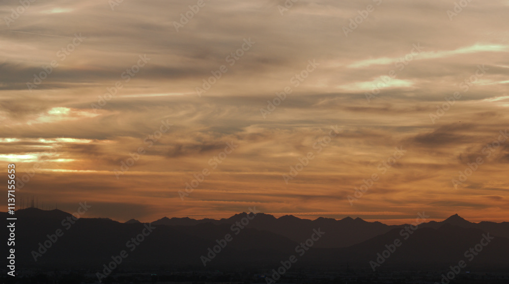 Desert Skies with swirls of clouds at golden hour. Desert Skies with swirls of clouds at golden hour.