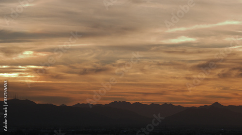 Desert Skies with swirls of clouds at golden hour.