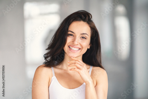 A young Caucasian woman is pampering herself in her home bathroom. She smiles brightly, showcasing her beauty while embracing a moment of relaxation and self-care. Free Download A young Caucasian woman is pampering herself in her home bathroom. She smiles brightly, showcasing her beauty while embracing a moment of relaxation and self-care. - GFXLoad