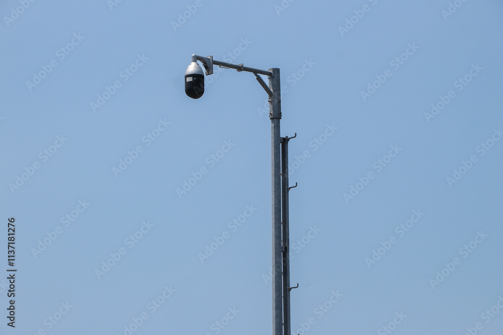 Three CCTV cameras and and an autonomous lighting system based on an LED lamp are installed on pole located on city street Three CCTV cameras and and an autonomous lighting system based on an LED lamp are installed on pole located on city street