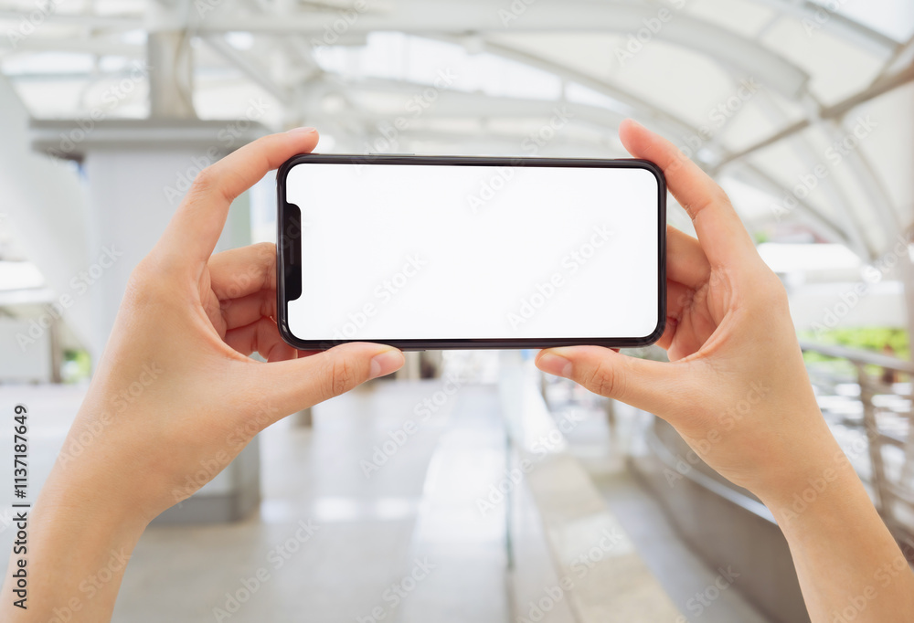 Hand holding smartphone mockup of blank screen, Take your screen to put on advertising. Hand holding smartphone mockup of blank screen, Take your screen to put on advertising.