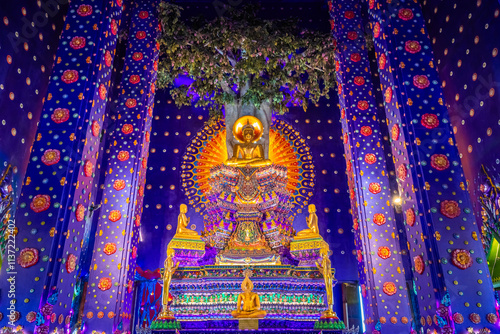 Wat Klang Khlong Watthanaram, or Wat Muang, in Sena, Ayutthaya, is famed for its vibrant purple ordination hall and intricate decorations, making it a notable landmark in the area.