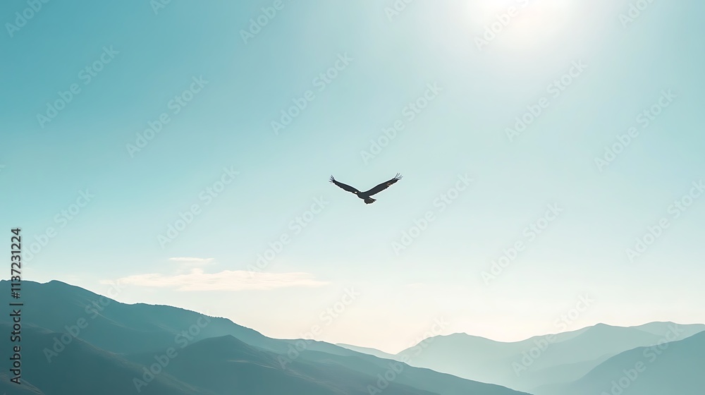 A lone bird soars above majestic mountains A lone bird soars above majestic mountains