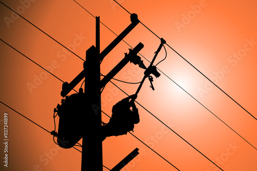 The power lineman use clamp stick (insulated tool) to closing a transformer on energized high-voltage electric power lines. The power lineman must be trained because it is a risky job.	