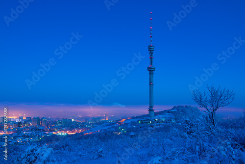 The famous TV tower on Mount Kok Tobe in the Kazakh city of Almaty on a winter morning photo