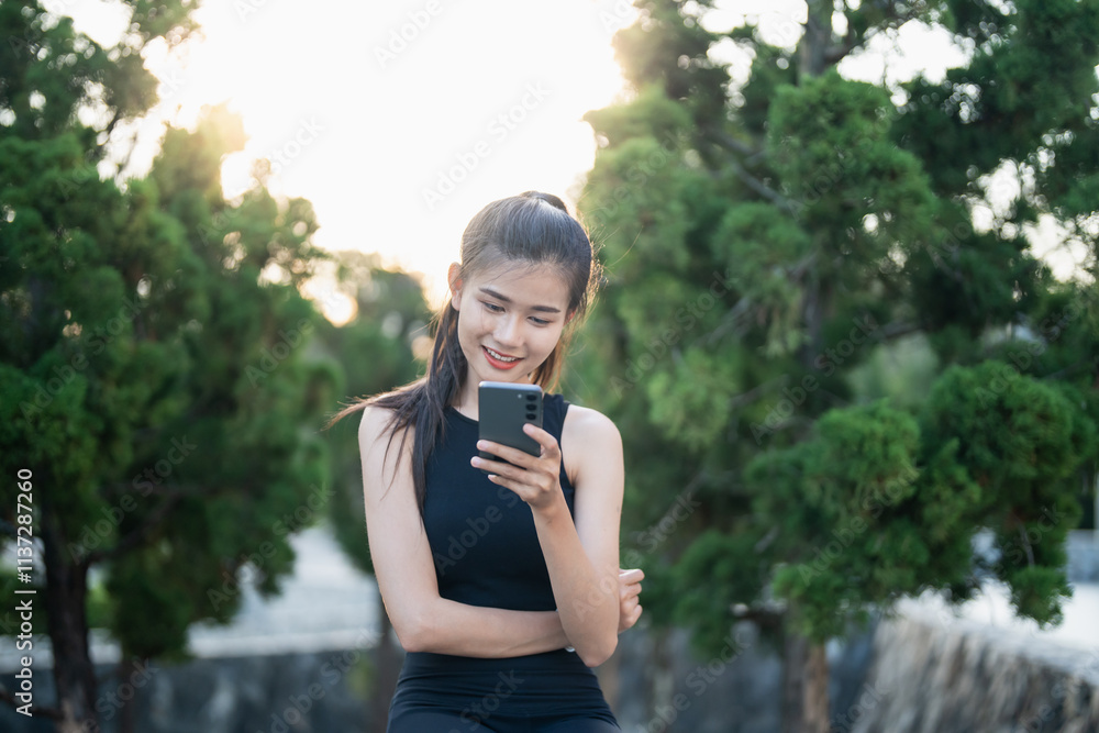 Fototapeta premium Asian woman using voice assistant on smartphone &nbsp;conversation with online assistant&nbsp;Voice chat bot conversational AI Modern Technologies.
