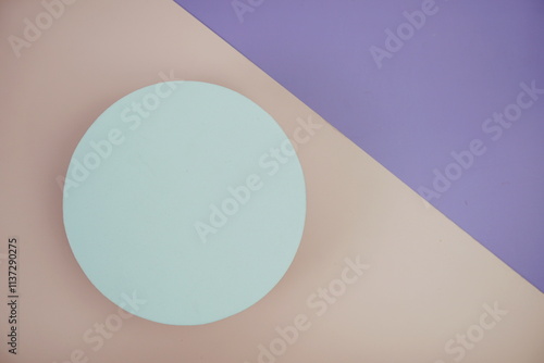 Top view of empty white cirle on pink and purple geometric background photo